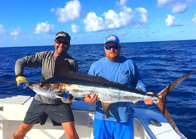 Angel with the big catch during the fishing tour he took with his family.