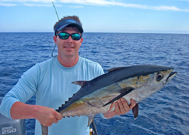 Edward with the fish he caught during the fishing trip in Cozumel.